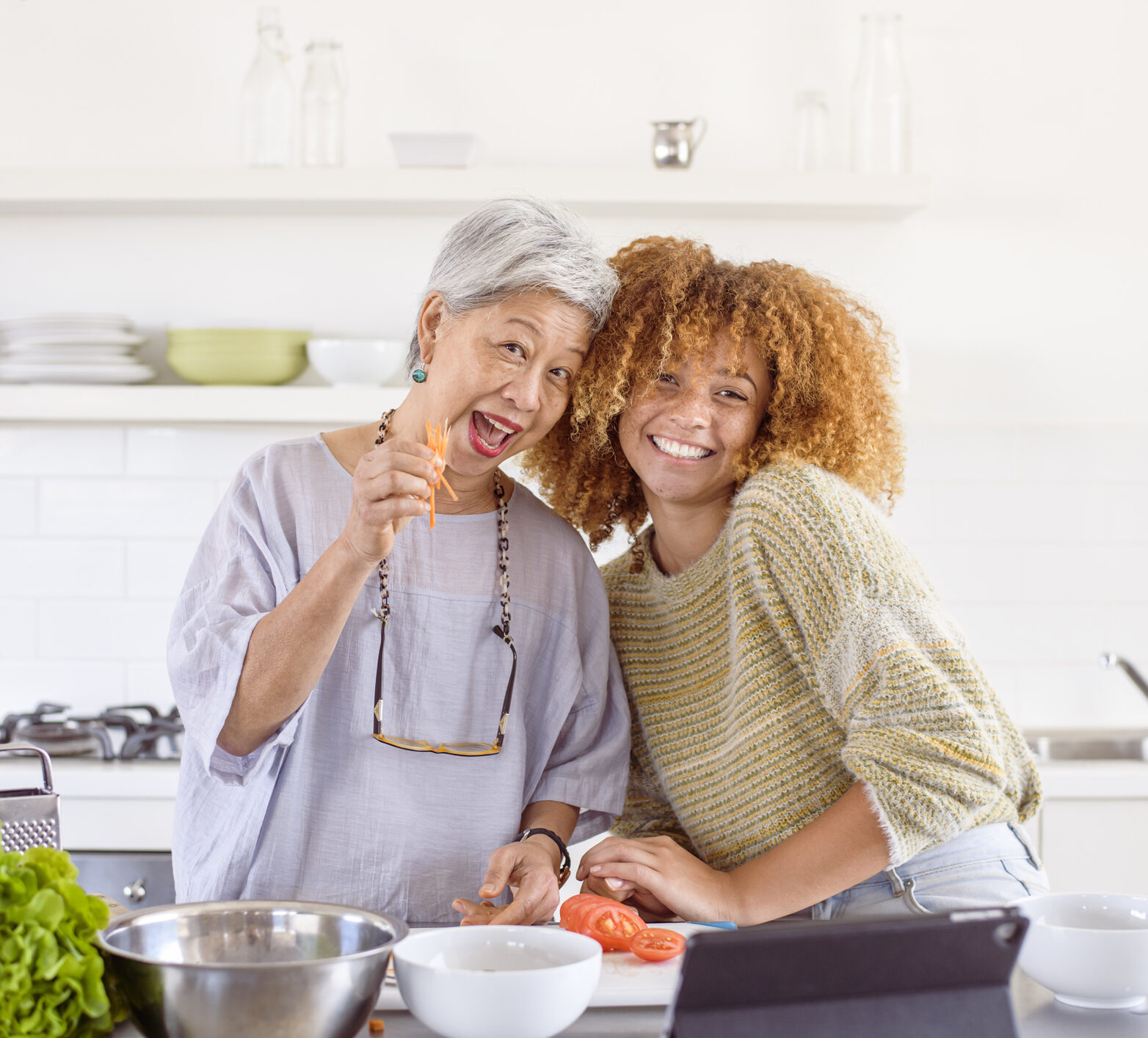 Happy senior woman preparing healthy meal with nutritionist