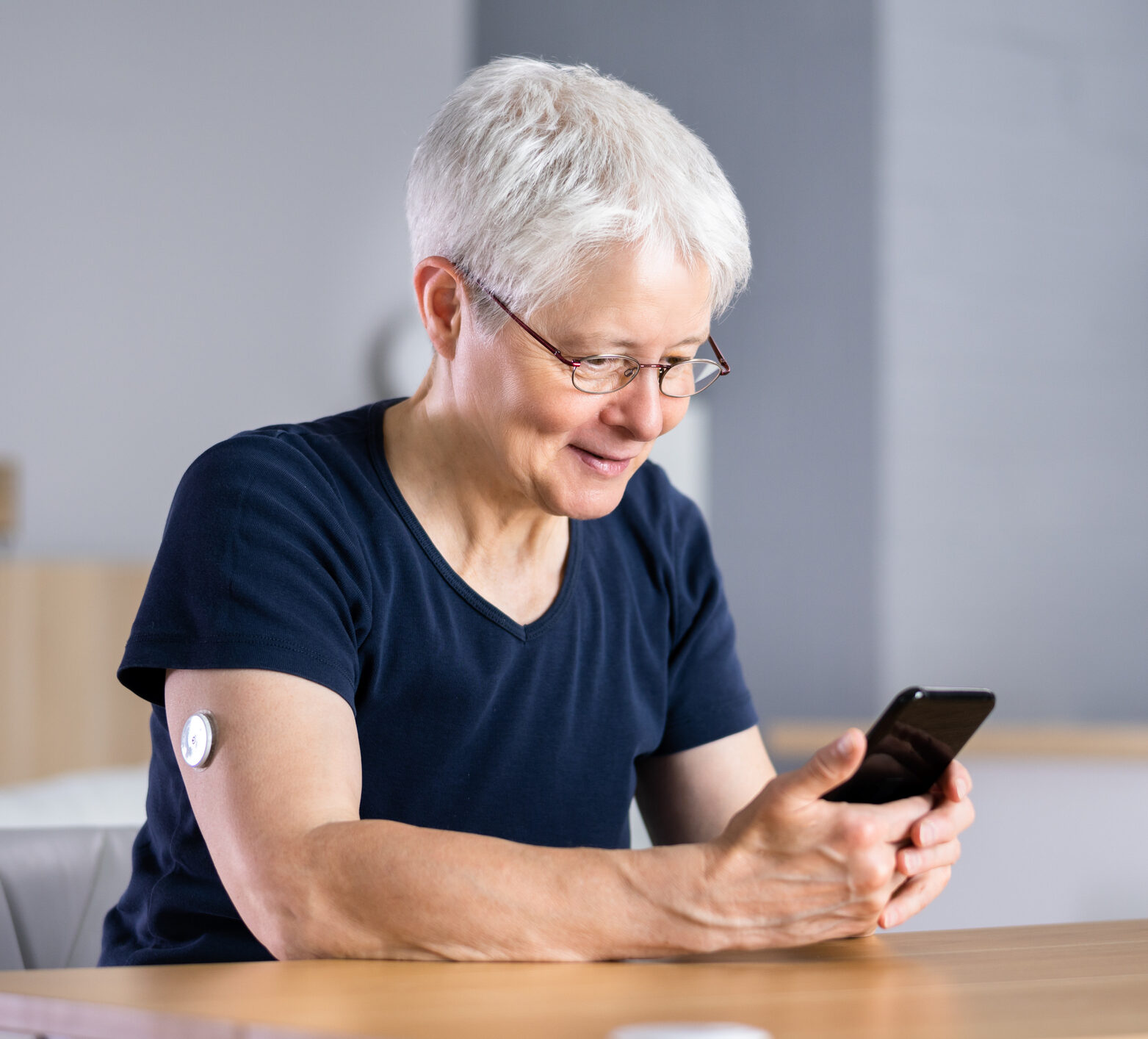 Woman smiling looking at time in range on her phone