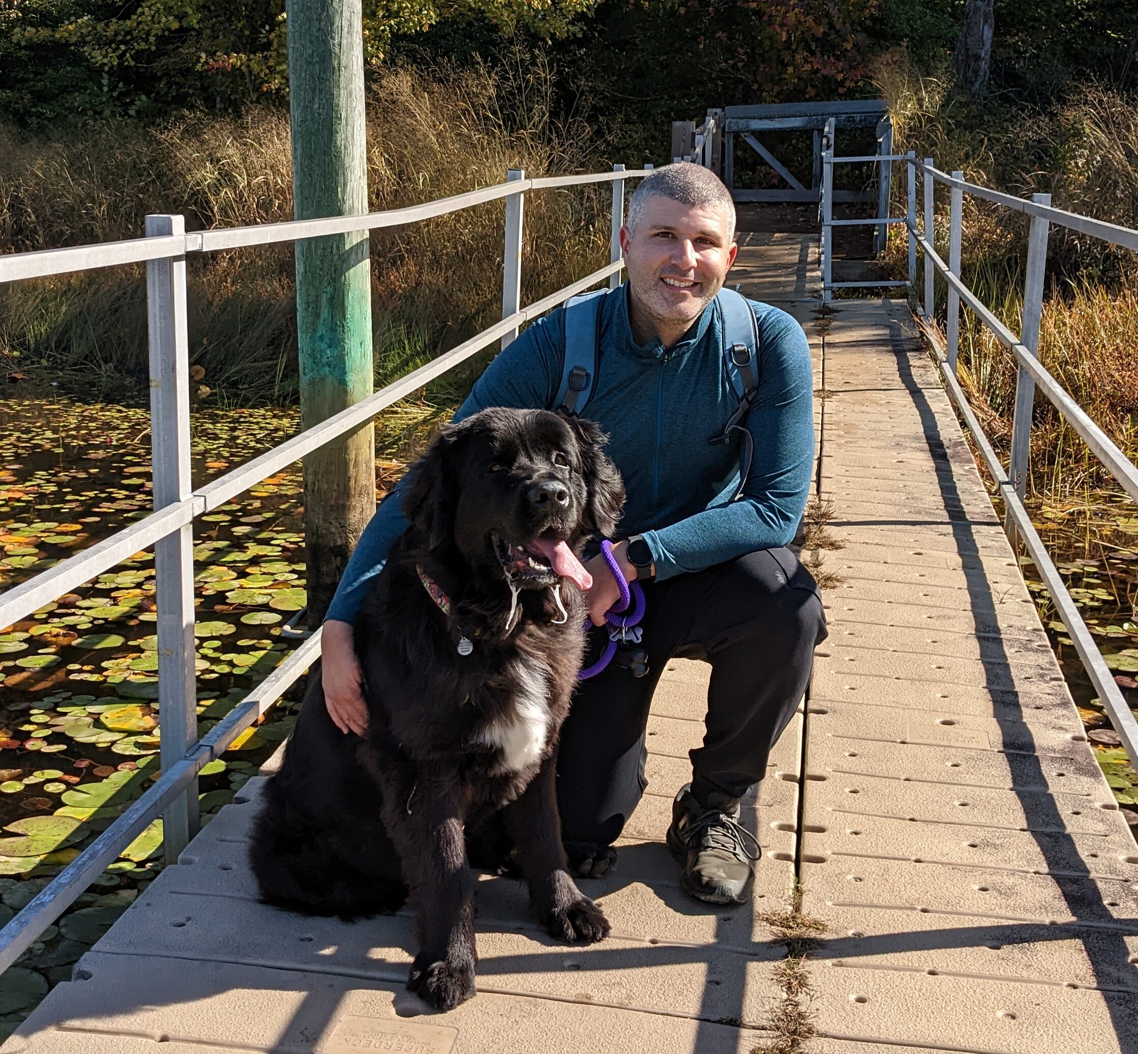 Photo of man, Benjamin, with his dog sharing his story with time in range