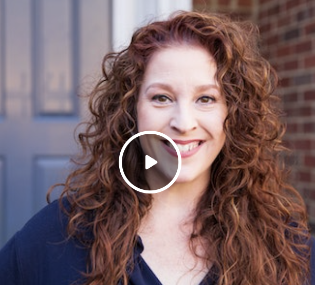 Woman with red curly hair talking about how time in range has helped her with play button over her face (indicates video)