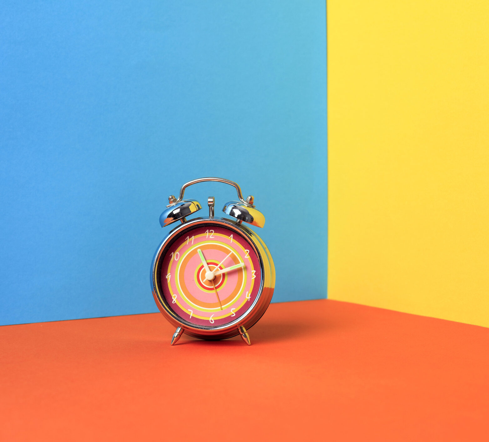 Alarm clock on a color background