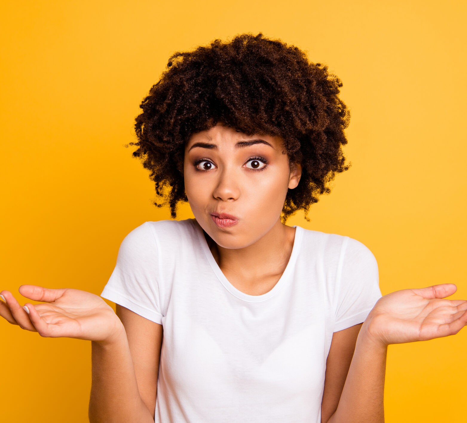 Woman with dark curly hair looking confused and asking: what is time in range anyway?