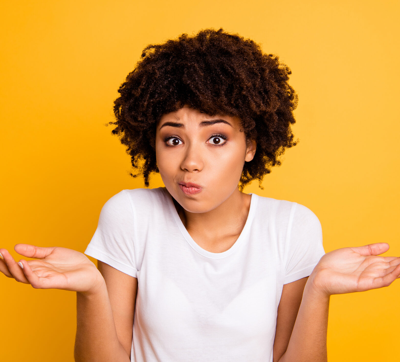 Woman with dark curly hair looking confused and asking: what is time in range anyway?