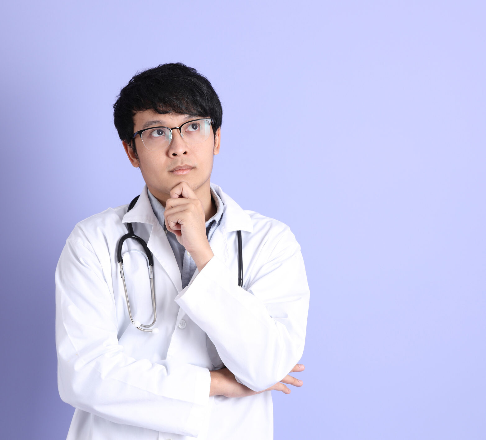 The young adult Asian physician standing on the purple background. Bringing time in range into practice