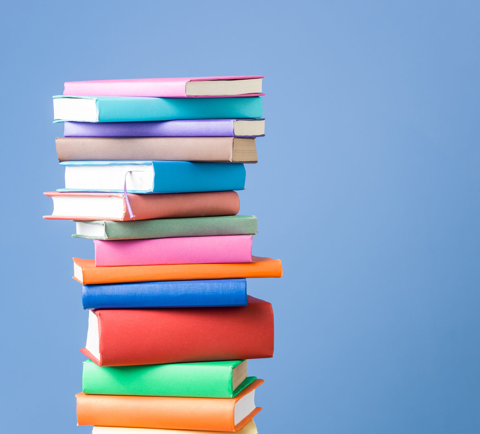 Multi colored books on blue background, meant to look like they're full of information about time in range.